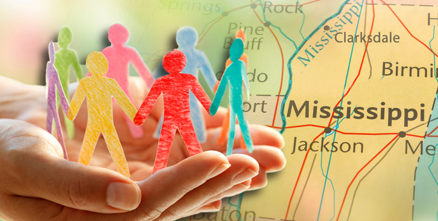 Mississippi map with colorful paper people cutouts in palm of hands